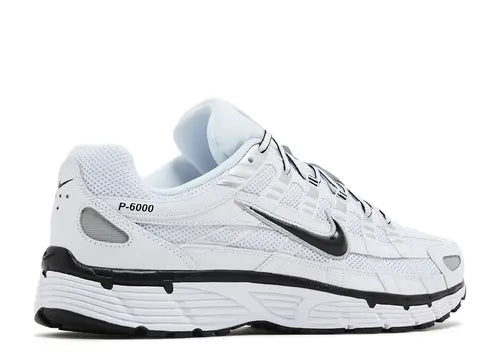 White Nike running shoe with black accents